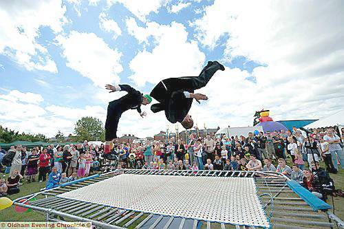 BOUNCING around . . . comedy trampolinists entertain the crowd. To see or order all our pictures from this event, click the “Buy a Photo” link at the top of the page 