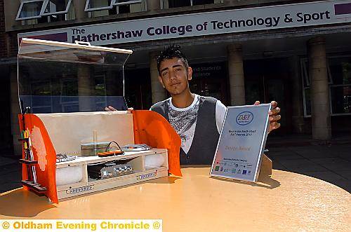 DESIGNER Hasnain Iqbal with his music centre and award.
DESIGNER Hasnain Iqbal with his music centre and award.