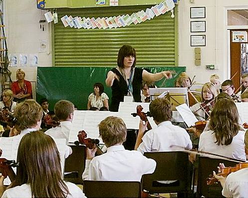 Jane conducts the Crompton House Junior Orchestra.
Jane conducts the Crompton House Junior Orchestra.