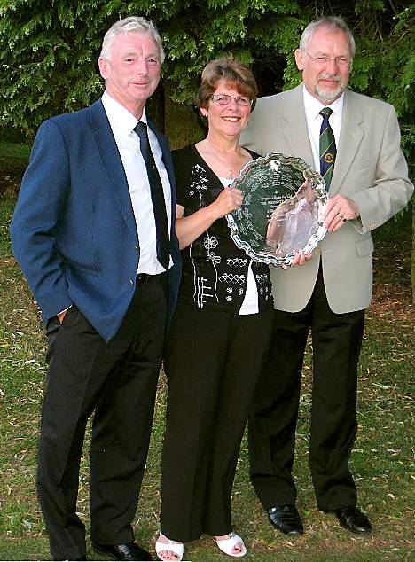 CROMPTON and Royton president Steve Mills (left) presents the salver to Audrey Whittaker and Gordon Lamb.
CROMPTON and Royton president Steve Mills (left) presents the salver to Audrey Whittaker and Gordon Lamb.