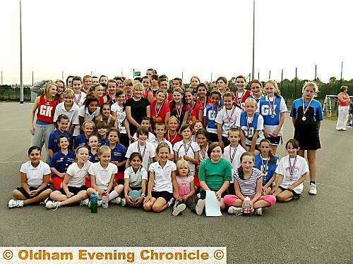 A GOOD TIME WAS HAD BY ALL . . . youngsters show off medals after the Hathershaw Netball Youth Group League. A GOOD TIME WAS HAD BY ALL . . . youngsters show off medals after the Hathershaw Netball Youth Group League.