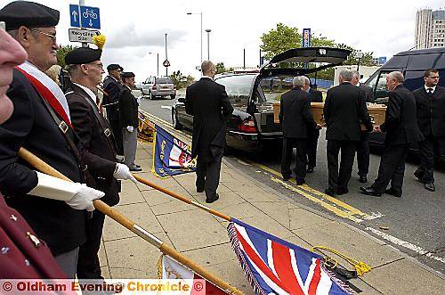 Flags are lowered at Ellen Brierley’s funeral. 