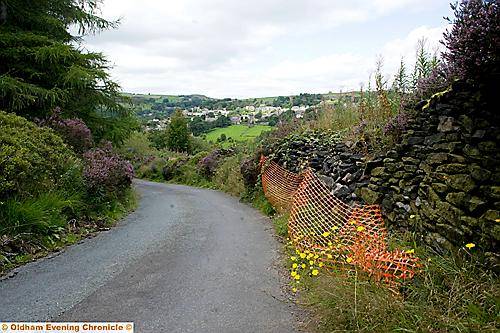 CRUMBLING . . . Ladcastle Road will be closed for wall repairs CRUMBLING . . . Ladcastle Road will be closed for wall repairs