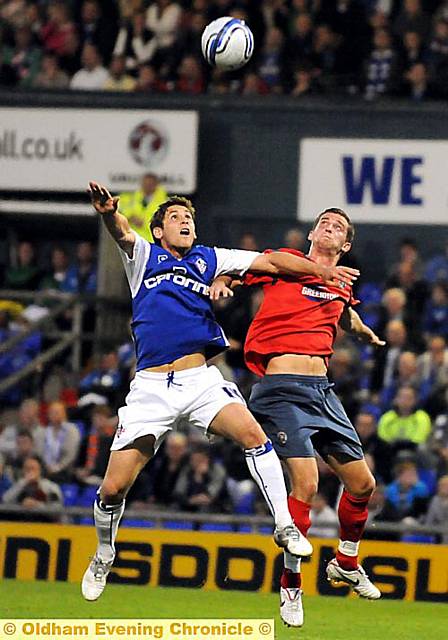 EYES ON THE BALL: Athletic midfielder Dean Furman attempts to win a header. 