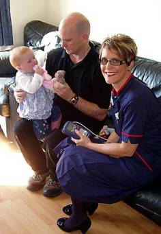 Jane Ramm with one-year-old patient Sarah Brooks and her dad Chris Brooks Jane Ramm with one-year-old patient Sarah Brooks and her dad Chris Brooks