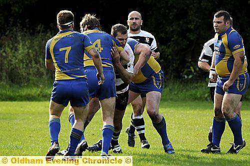 nowhere to go... Chris Conway, of Saddleworth Rangers, runs into York Acorn’s Andy Gargan. nowhere to go... Chris Conway, of Saddleworth Rangers, runs into York Acorn’s Andy Gargan.