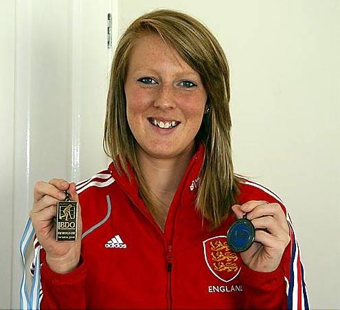 NICOLA White shows off bronze medals won at the World Cup and Champions Trophy events. NICOLA White shows off bronze medals won at the World Cup and Champions Trophy events.