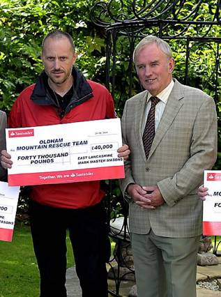 MICK Nield of Oldham Mountain Rescue received the cheque from provincial grand master Keith Schofield at Middleton Masonic Hall. MICK Nield of Oldham Mountain Rescue received the cheque from provincial grand master Keith Schofield at Middleton Masonic Hall.