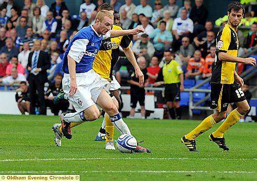 CHRIS TAYLOR attempts to side-step a Bristol Rovers challenge. 