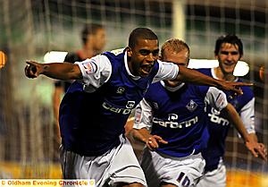 AND THAT MAKES TWO: Tom Adeyemi shows his delight after doubling Athletic’s lead. 