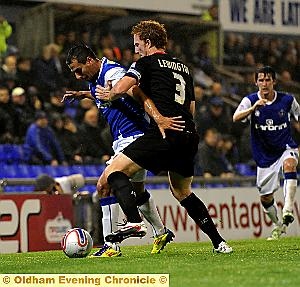 I’M BEHIND YOU: Filipe Morais holds off MK Dons full-back Dean Lewington