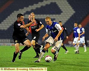 NEAT FEET: David Mellor, who impressed at left-back, side-steps a challenge. All pictures: Alan Howarth 