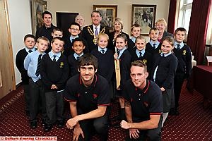 STARS Kyle Hogg and Luke Procter with Mayor of Oldham Richard Knowles and Mayoress Valerie Knowles, council officials and pupils from Thorp Primary School  