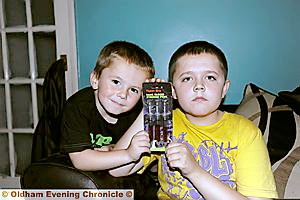 Brothers Levi (left) and Leon Wade with the fake blood syringe pens. 

