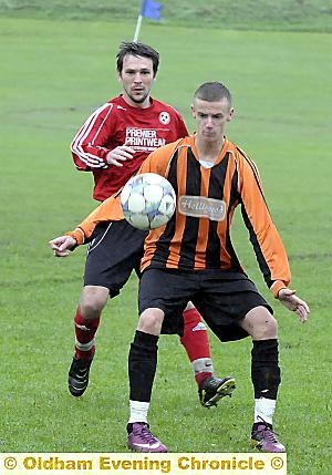 LIMESIDE King George’s Dean Henry shields the ball from Damian Gilks, of Red Star. 