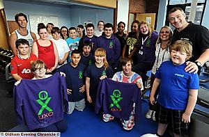 Leaders and teenagers at the UXO project celebrate their nomination 