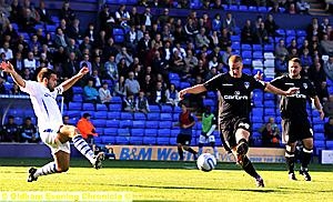 ATTEMPT: Tranmere blocks an effort from Athletic full-back David Mellor. 