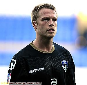 DEJECTION . . . Athletic defender Nathan Clarke walks off the pitch after defeat at Tranmere. With Zander Diamond injured, Clarke partnered Jean-Yves Mvoto in the centre of defence.