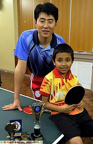 TROPHY haul: Amir with top Chinese coach Victor Shi Guang TROPHY haul: Amir with top Chinese coach Victor Shi Guang