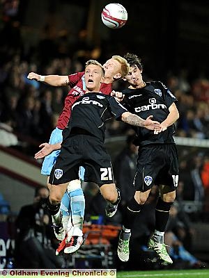 AERIAL ATTACK: Kirk Millar (left) and Kieran Lee battle for a high ball at Glanford Park last night. 
