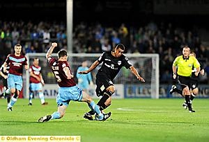 BATTLE FOR THE BALL: Athletic midfielder Tom Adeyemi is stopped in his tracks by Scunthorpe United captain Michael Nelson. 