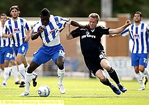 Nathan Clarke (black kit) get in the thick of the action.
Nathan Clarke (black kit) get in the thick of the action.
