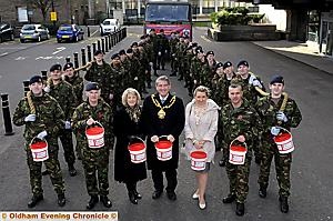 Soldiers from the Territorial Army pull a truck to Manchester, the Mayor Richard Knowles, Mayoress Valerie Knowles and Youth Mayor Charlotte Birtwistle with Major Paul A Grady ( left ) and Staff Sgt Jason Shawcross ( right )
Soldiers from the Territorial Army pull a truck to Manchester, the Mayor Richard Knowles, Mayoress Valerie Knowles and Youth Mayor Charlotte Birtwistle with Major Paul A Grady ( left ) and Staff Sgt Jason Shawcross ( right )