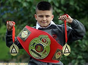 MEDAL MAGIC: Sohail Mahmood, of Yew Tree Community School, shows off his medals. MEDAL MAGIC: Sohail Mahmood, of Yew Tree Community School, shows off his medals.