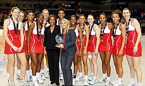 DELIGHT: England celebrate their World Netball Series success. Pictured are Jo Harten (left), Sara Bayman, Stacey Francis, Kadeen Corbin, Emma Dovey, Molly Rhone (IFNA president), Eboni Beckford Chambers, Anna Mayes (head coach), Sasha Corbin, Laura Malcolm, Jade Clarke (captain), Pamela Cookey, Serena Guthrie and Rachel Dunn. DELIGHT: England celebrate their World Netball Series success. Pictured are Jo Harten (left), Sara Bayman, Stacey Francis, Kadeen Corbin, Emma Dovey, Molly Rhone (IFNA president), Eboni Beckford Chambers, Anna Mayes (head coach), Sasha Corbin, Laura Malcolm, Jade Clarke (captain), Pamela Cookey, Serena Guthrie and Rachel Dunn.