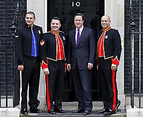 Prime Minister David Cameron with The Soldiers (Left to right) Lance Corporal Ryan Idzi, Staff Sergeant Richie Maddocks and Sergeant Major Gary Chiltern, on the steps of Downing Street to help launch the 2011 Poppy Appeal song.
Prime Minister David Cameron with The Soldiers (Left to right) Lance Corporal Ryan Idzi, Staff Sergeant Richie Maddocks and Sergeant Major Gary Chiltern, on the steps of Downing Street to help launch the 2011 Poppy Appeal song.