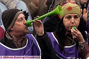 NOISY protesters: public-sector workers blow their vuvuzelas and whistles  

