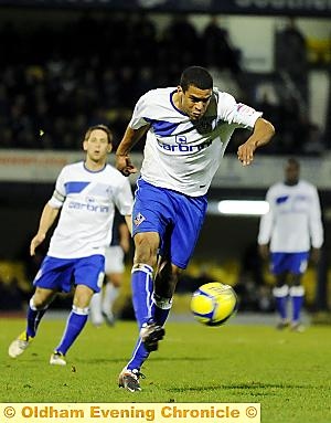 DRIVING FORCE . . . Tom Adeyemi displays power and pace. 