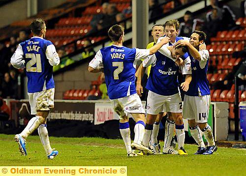 WELL DONE, MATE . . . Athletic winger Filipe Morais is mobbed by his team-mates after his first-half goal at Walsall last night. 
