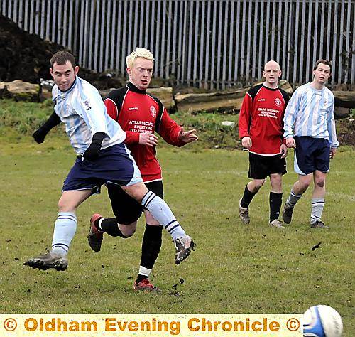 FAILSWORTH Dynamos’ Chris Haskins gets in front of Kevin Knowles, of Weavers Arms. 