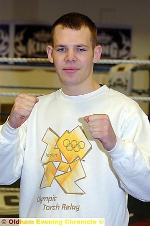 Pleased as punch: Thai boxer Andrew Lofthouse has been chosen to carry the Olympic torch
Pleased as punch: Thai boxer Andrew Lofthouse has been chosen to carry the Olympic torch
