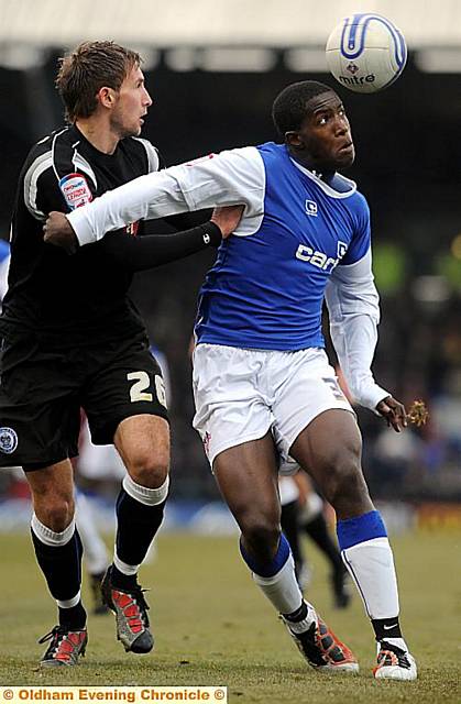 EYES ON THE BALL... Oumare Tounkara holds off Rochdale defender Craig Dawson.