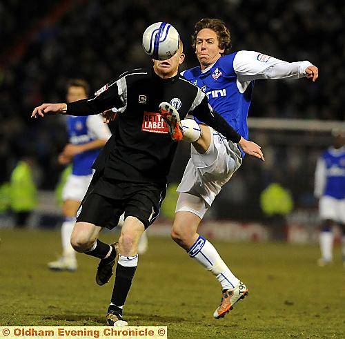ATHLETIC striker Ryan Brooke and Jason Kennedy battle for the ball