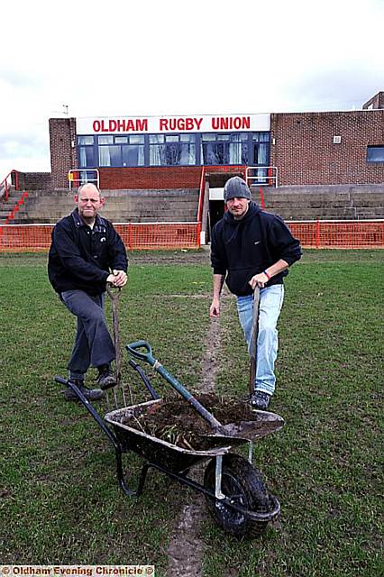 PAYBACK time ... Darren Young (above, left), helps out Oldham Rugby Club groundsman Alan Hollingsworth. PAYBACK time ... Darren Young (above, left), helps out Oldham Rugby Club groundsman Alan Hollingsworth.