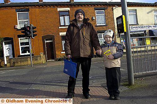 SAFETY first . . . Michael and James Bishop at the pelican crossing in Denton Lane, Chadderton
SAFETY first . . . Michael and James Bishop at the pelican crossing in Denton Lane, Chadderton