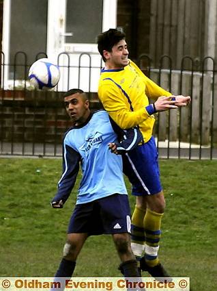 SPOT THE BALL... Kyle Harrop (right), of Chaddy End, leaps above Coppice's Waqas Younis. 
