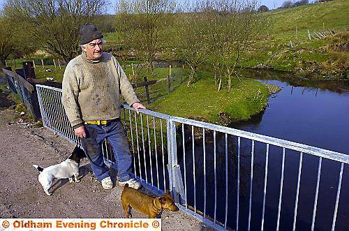 FARMER Ben Lancaster at the polluted River Irk. 