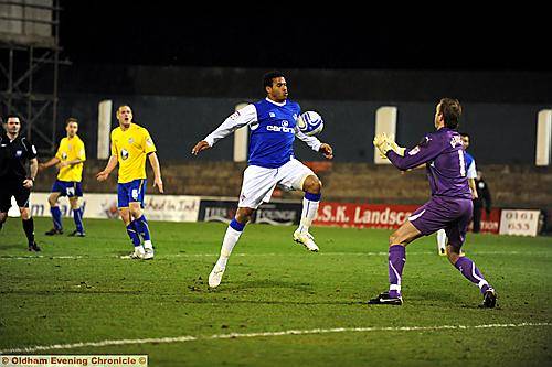 ATHLETIC substitute Reuben Reid handles the ball as he tries to bring it under control in front of goalkeeper Nicky Weaver. 