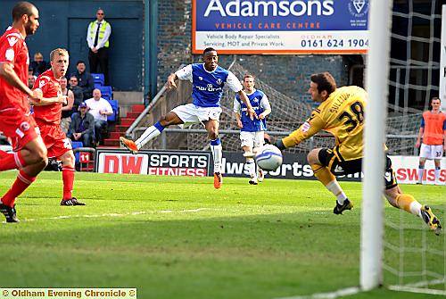 SO CLOSE . . . Cedric Evina fires in a shot from the left which beats goalkeeper John Sullivan, but flies narowly wide of the post. 