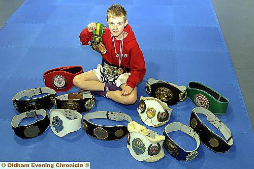 BOXING CLEVER . . . young Thai-boxer Joe Tomlin shows off his belts.
BOXING CLEVER . . . young Thai-boxer Joe Tomlin shows off his belts.