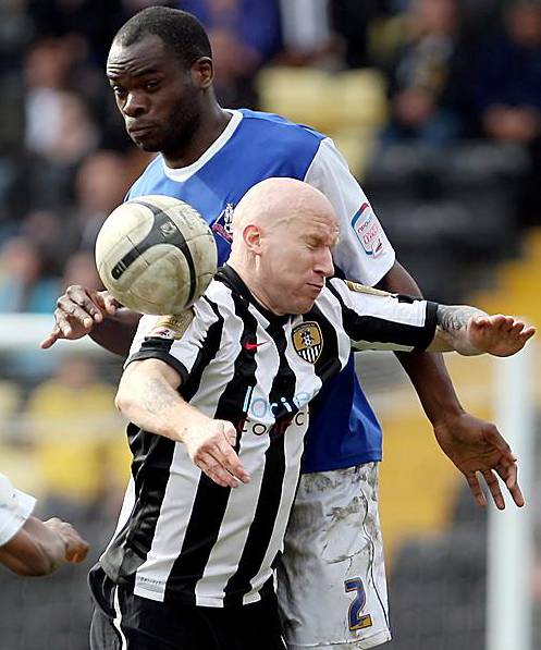 BIG JEAN . . . Athletic’s giant centre-back climbs high above Notts County’s ex-Boundary Park favourite Lee Hughes to clear the danger. BIG JEAN . . . Athletic’s giant centre-back climbs high above Notts County’s ex-Boundary Park favourite Lee Hughes to clear the danger.