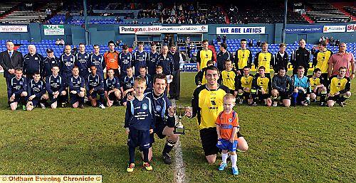 HANDS ON . . . mascots Harrison Dale (five, left) and three-year-old Shane Keating (right) flank Rifle Range Royal Blues captain Andrew Oakes and his High Crompton counterpart, Andrew Smith. 