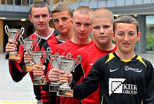 TROPHY TIME... captains Sam Jones (Year 11s, left) Nathan Chorlton (Year Eights), Luke Daly (Year 10s), Charlie Fuller (Year Nines), Mason Fawes (Year Sevens). TROPHY TIME... captains Sam Jones (Year 11s, left) Nathan Chorlton (Year Eights), Luke Daly (Year 10s), Charlie Fuller (Year Nines), Mason Fawes (Year Sevens).