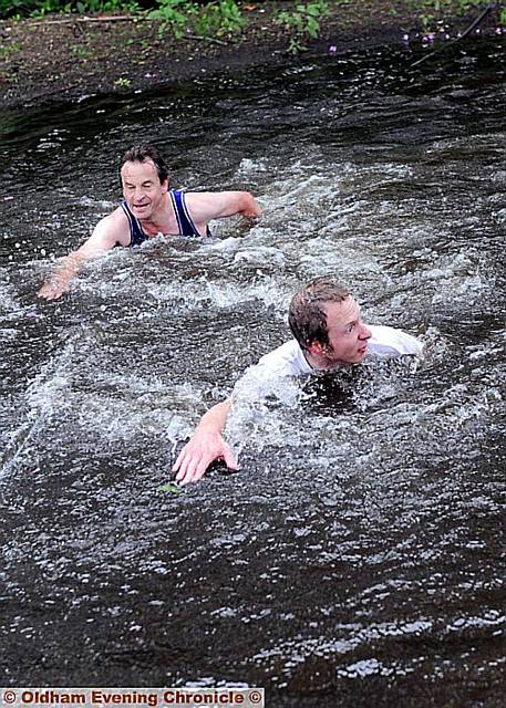 Euro MP Chris Davies, top, takes the plunge during the dramatic fell race 