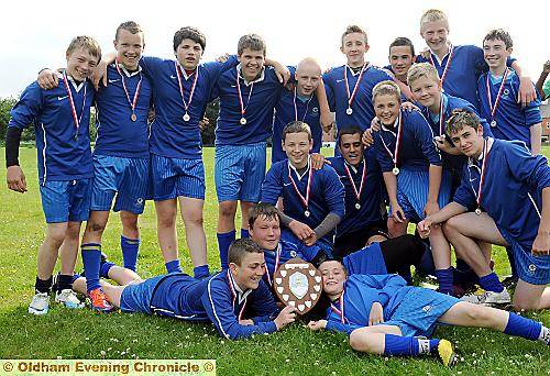 MILES OF SMILES: Saddleworth celebrate after their success over Waterhead Academy in the Year Nines final.