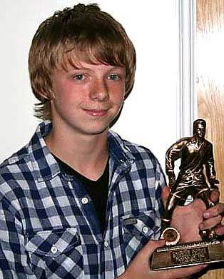 MARKSMAN . . . James Larty receives his player of the year award.
MARKSMAN . . . James Larty receives his player of the year award.
